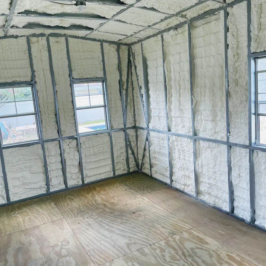 Closed-cell spray foam insulation applied to wall cavities in a residential project in Tenafly
